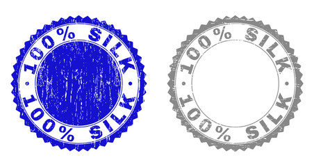 100% SILK stamp seals with distress texture in blue and gray colors isolated on white background. Vector rubber imitation of 100% SILK text inside round rosette. Stamp seals with unclean styles.