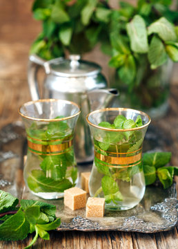 Mint tea with sugar cubes