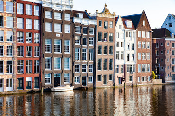Fototapeta na wymiar postcard picture of beautiful canals and traditional Dutch buildings in Amsterdam, the Netherlands
