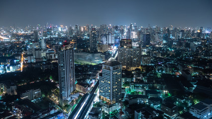 Business area in Bangkok, Thailand, showing buildings and traffic at night