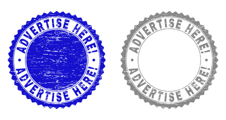 ADVERTISE HERE! stamp seals with distress texture in blue and grey colors isolated on white background. Vector rubber imitation of ADVERTISE HERE! text inside round rosette.