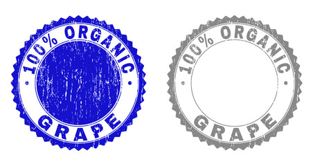 100% ORGANIC GRAPE stamp seals with grunge texture in blue and gray colors isolated on white background. Vector rubber watermark of 100% ORGANIC GRAPE tag inside round rosette.