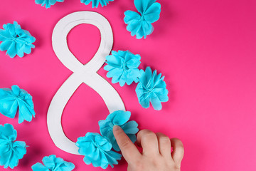 Diy eight made cardboard decorated artificial flower made blue tissue paper napkin pink background.