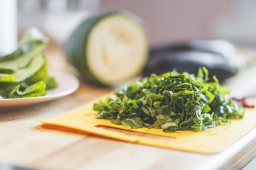 Cut vegetables on the yellow cutting board