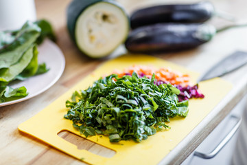 Cut vegetables on the yellow cutting board
