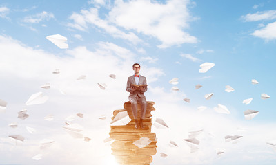 Young businessman or student in blue sky studying the science