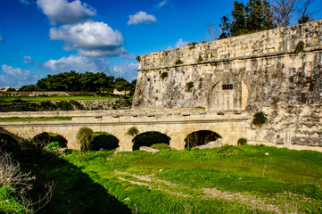 Obraz premium City walls and old railway bridge at Floriana, Malta.