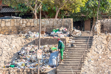18/11/2018 Cairo, Egypt, young people collect and sort garbage in large sacks on the streets of the...