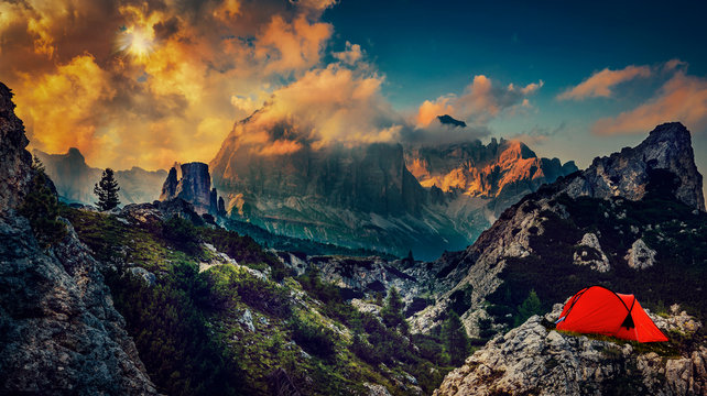 Great sunset bivouac view of the top Tofana di Rozes and Cinque Torri range in  Dolomites, South Tyrol. Location Cortina d'Ampezzo, Italy, Europe. Dramatical cloudy scene. Beauty of mountains world.