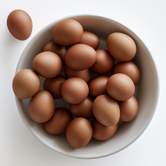 Bowl of eggs on white background