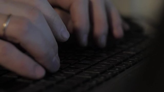 Hands typing on the keyboard. Close-up