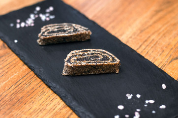 Dark plate with raw organic sweet rolls