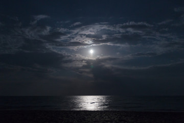 Landscape with the moon on the beach in the Crimea