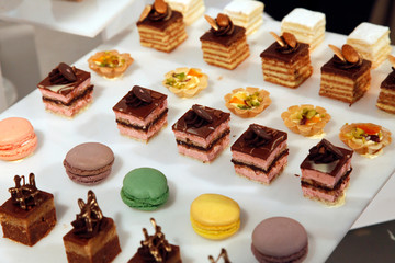 Colorful desserts and pastry served on a wedding party