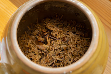 decocted Chinese medicinal herbs in an enamel pot