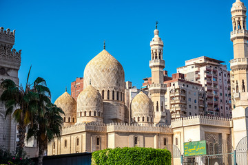 .18/11/2018 Alexandria, Egypt, Incredibly beautiful mosque Abo El Abass against blue sky and palm...