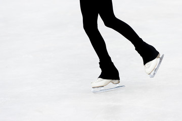 slender legs of girl skate. competitions in figure skating, performance of young athletes