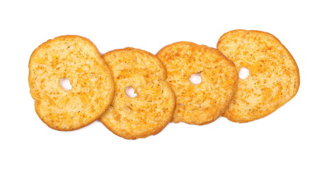Pizza flavored baked crispy bread rusks, snacks isolated on white background, top view