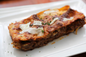 Beef lasagna on wooden background , Italian food