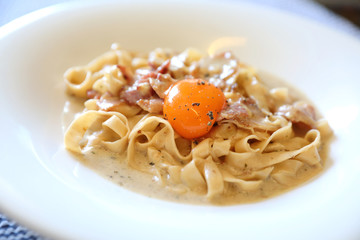 Homemade pasta with white sauce , spaghetti carbonara , italian food