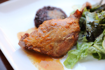 duck confit with rice and salad , italian food style
