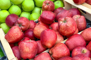 Pile of apples in a wooden boxes (Close up)