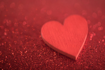 Red heart on glitter background in love concept
