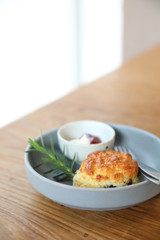 Scones with cream and strawberry jam