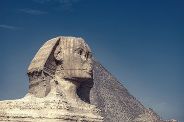 .Sphinx on blue sky background