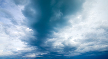 Blue sky background with tiny clouds