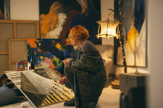 Artist Painting In Her Home