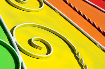 Metal texture of a piece of colored wall with a forged pattern