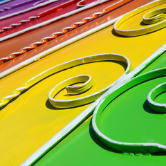 Metal texture of a piece of colored wall with a forged pattern