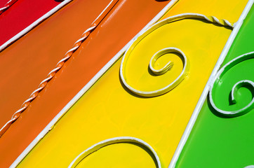 Metal texture of a piece of colored wall with a forged pattern