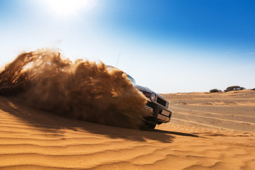 Fototapeta na wymiar Drifting offroad car 4x4 in desert