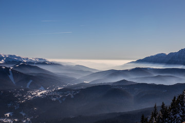 Fototapeta na wymiar Bucegi mountains viewed from Postavarul peak, Brasov, Transylvania, Romania