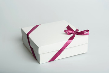 white paper box with ribbon