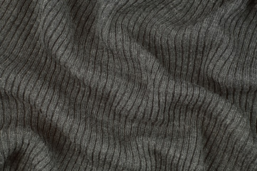 Wavy surface of the product. Knitted drapery.