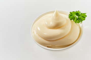 Small bowl of twirled spicy mayonnaise