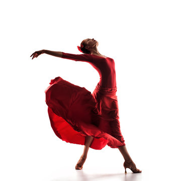 silhouette of woman dancer wearing red dress
