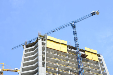 Construction site. High rise multi storey buildings under construction