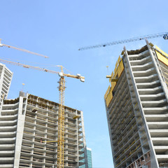 Construction site. High rise multi storey buildings under construction