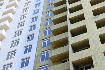 Residential multi store apartement building house facade under construction