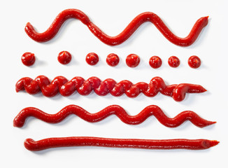 Assorted squiggles and lines of tomato sauce