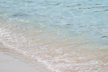 Beautiful sandy beach and soft blue ocean wave