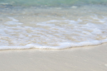 Beautiful sandy beach and soft blue ocean wave