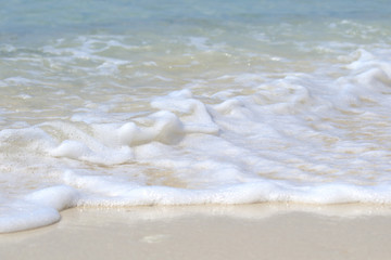 Beautiful sandy beach and soft blue ocean wave