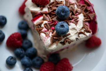 Crisp golden waffle served with whipped cream, vanilla ice cream and fresh blueberries and raspberries