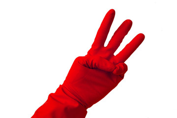 Hand in latex glove showing number three