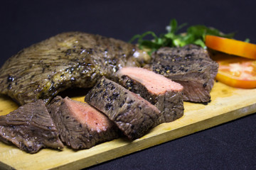 Medium Roast Steak on wooden plate 